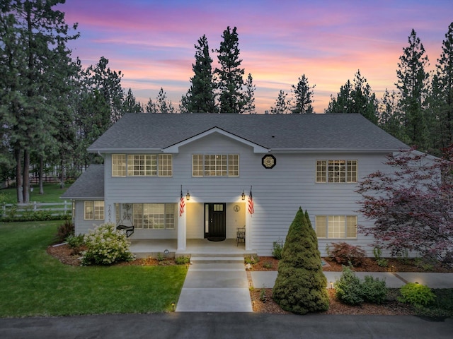 view of front of house featuring a lawn