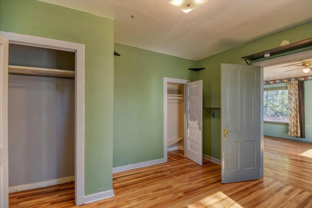 unfurnished bedroom featuring light wood-style flooring and baseboards