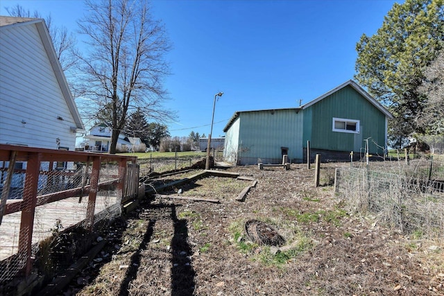 view of side of home with fence