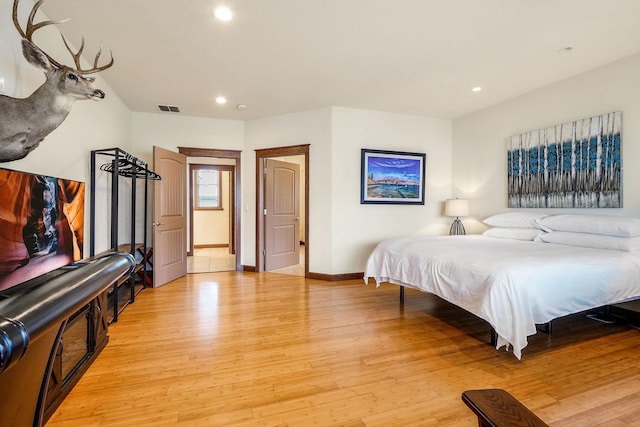 bedroom with light wood-type flooring