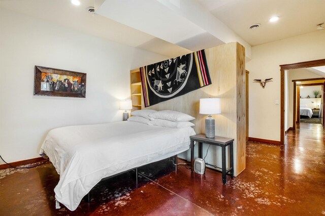 bedroom featuring concrete floors