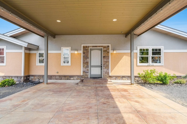 entrance to property with a patio area