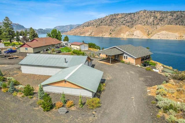 bird's eye view with a water and mountain view