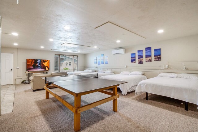 recreation room with light carpet and a wall mounted air conditioner