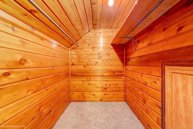 interior space featuring lofted ceiling and light carpet