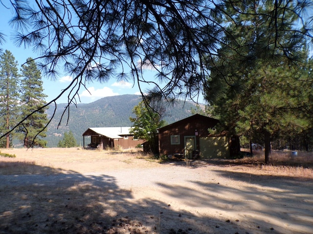 view of side of property with a mountain view