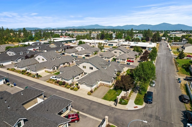 birds eye view of property with a mountain view