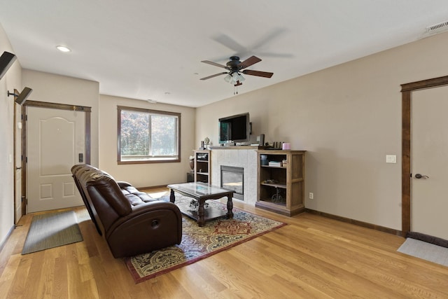 living room with hardwood / wood-style floors and ceiling fan