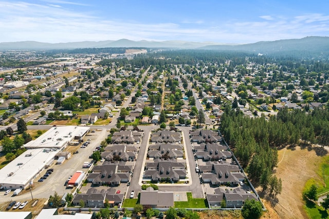 birds eye view of property with a mountain view