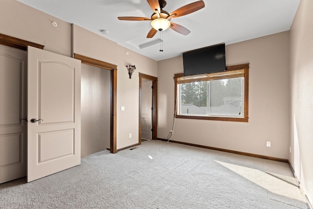 unfurnished bedroom featuring light carpet and ceiling fan