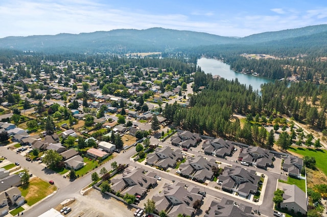 drone / aerial view with a water and mountain view