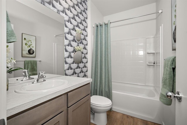 full bathroom with vanity, toilet, hardwood / wood-style flooring, and shower / bath combination with curtain