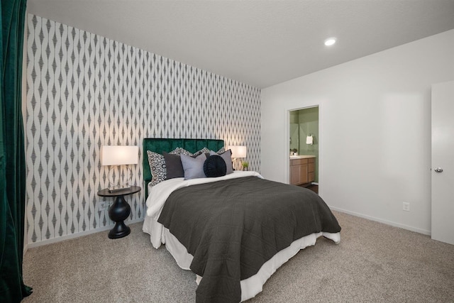 carpeted bedroom with ensuite bathroom