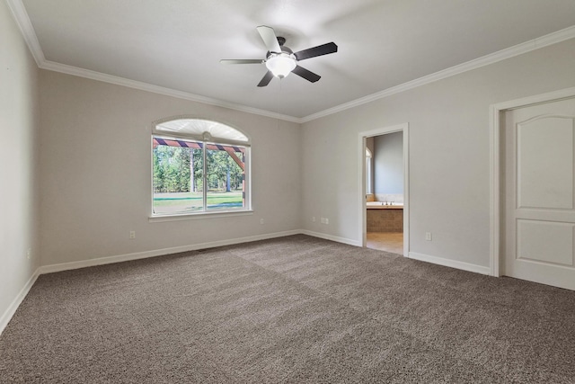 carpeted spare room with a ceiling fan, baseboards, and ornamental molding