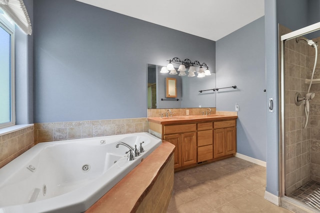 full bathroom featuring double vanity, a whirlpool tub, a shower stall, and a sink
