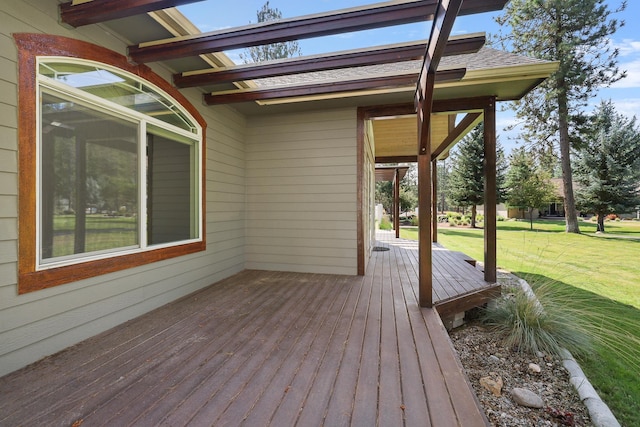 wooden deck with a lawn