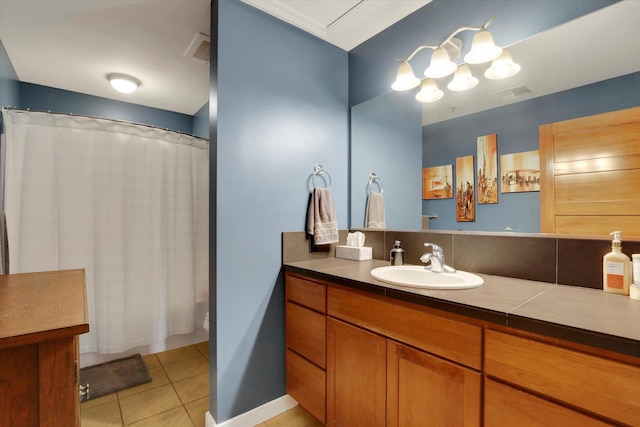 bathroom featuring a shower with shower curtain, vanity, and tile patterned flooring