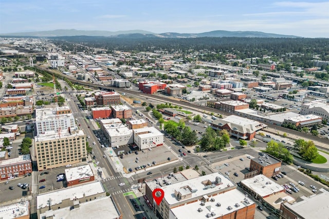 birds eye view of property with a mountain view