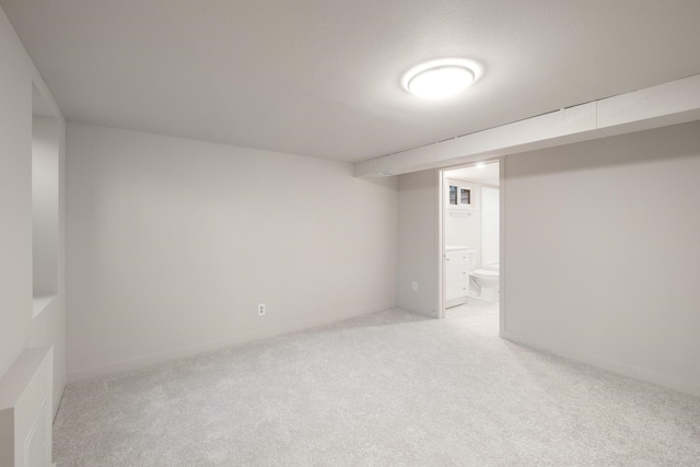 basement with light colored carpet