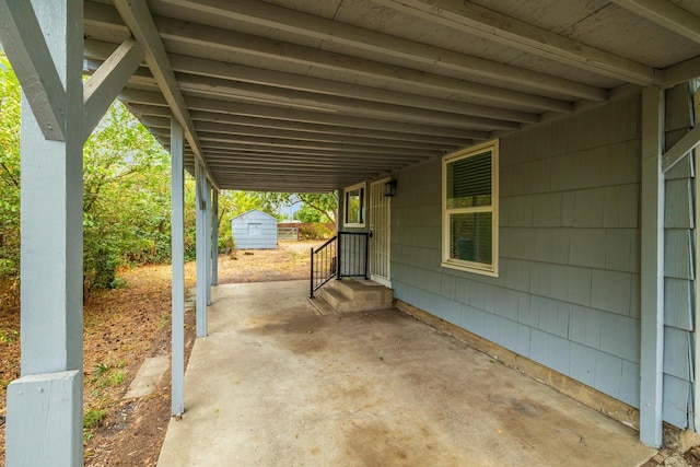 view of patio / terrace with a storage shed