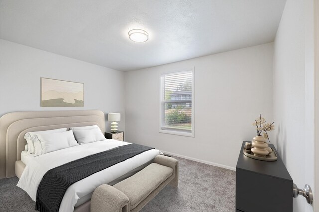 carpeted bedroom featuring a textured ceiling