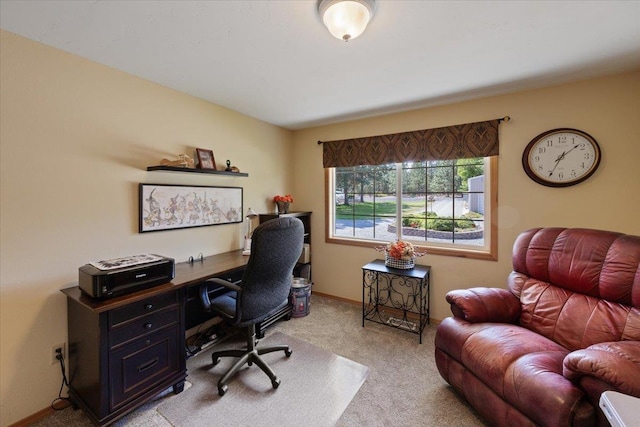 office area with light colored carpet and baseboards