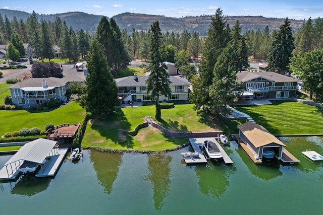 bird's eye view with a water and mountain view