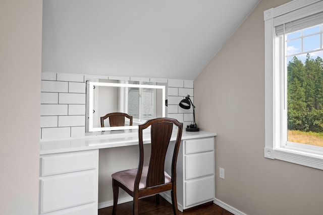 office area with vaulted ceiling and dark hardwood / wood-style flooring