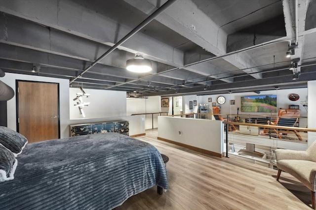 bedroom with hardwood / wood-style flooring