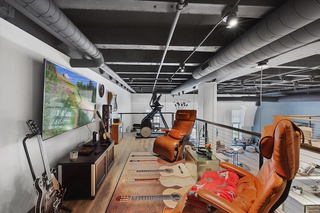 interior space featuring plenty of natural light and wood-type flooring