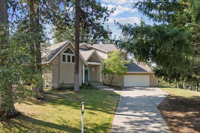 craftsman-style home with a garage and a front yard