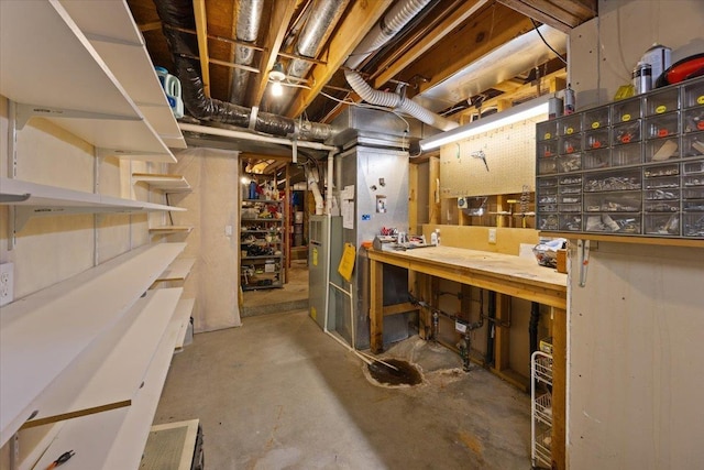 unfinished basement with a workshop area