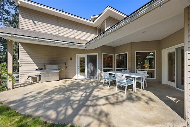 view of patio with outdoor dining space and area for grilling