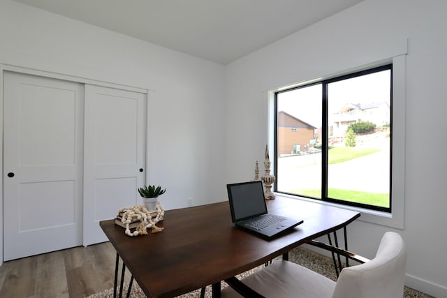 home office with hardwood / wood-style flooring