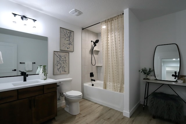 full bathroom featuring toilet, vanity, shower / bathtub combination with curtain, and wood-type flooring