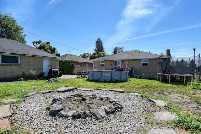 view of yard with a trampoline