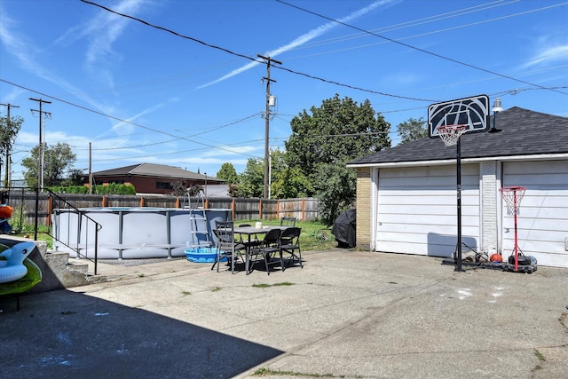 garage featuring a fenced in pool