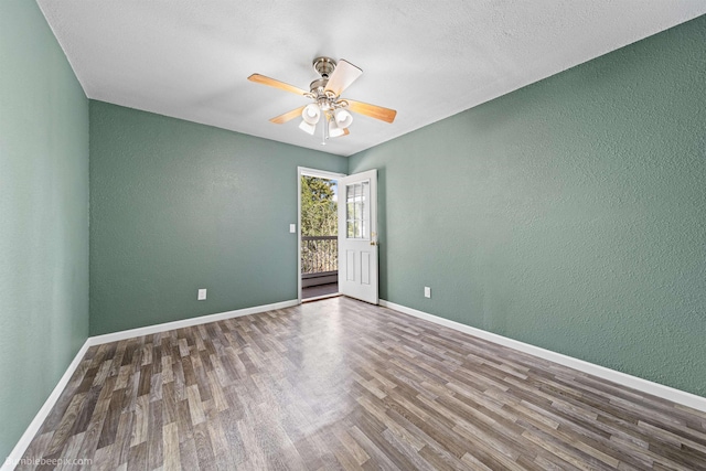 spare room with a textured ceiling, hardwood / wood-style flooring, and ceiling fan