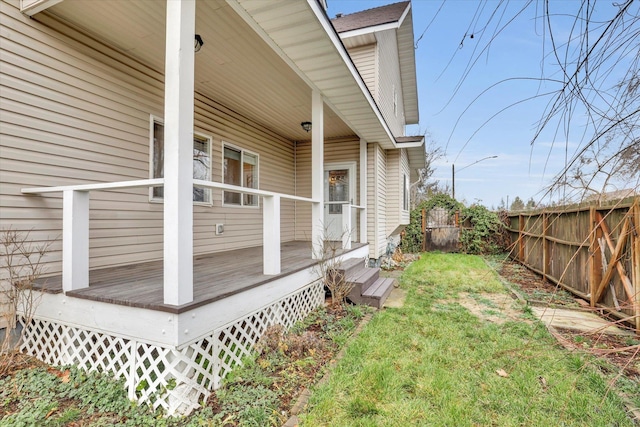 wooden terrace with a yard