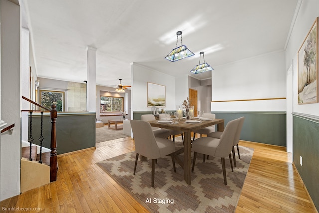 dining area featuring ceiling fan, crown molding, and light hardwood / wood-style flooring