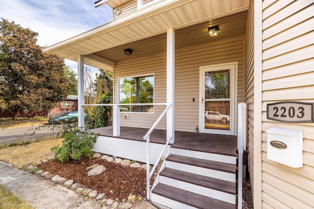 doorway to property featuring a porch