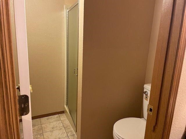 5307 N Argonne Ln # 6, Spokane, WA 99212 - bathroom featuring a shower stall and toilet