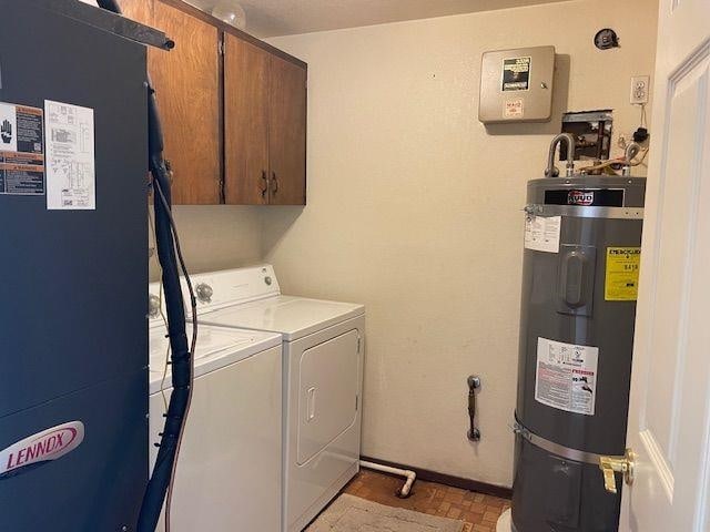 5307 N Argonne Ln # 6, Spokane, WA 99212 - washroom featuring water heater, cabinet space, washer and dryer, and baseboards