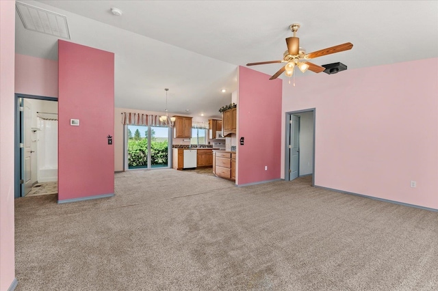 unfurnished living room featuring light carpet and ceiling fan with notable chandelier