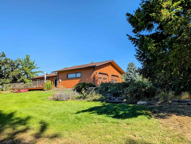 view of yard featuring a wooden deck