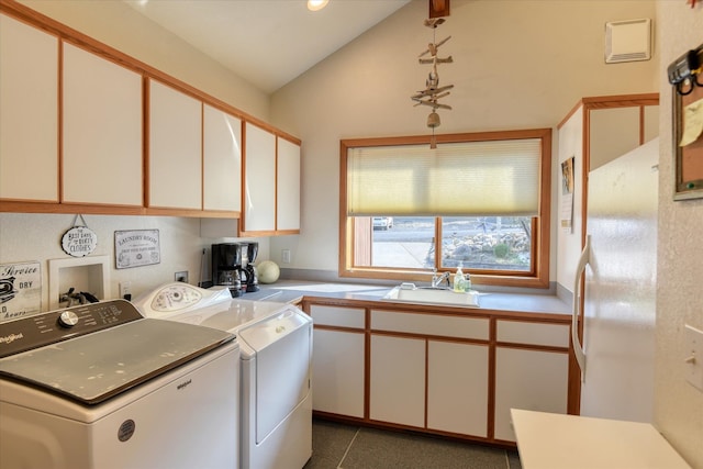 clothes washing area featuring independent washer and dryer and sink