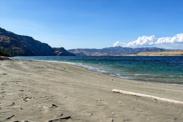 water view featuring a mountain view and a view of the beach