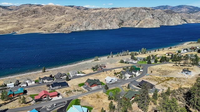 bird's eye view featuring a water and mountain view