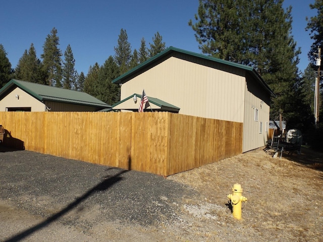 view of home's exterior with fence