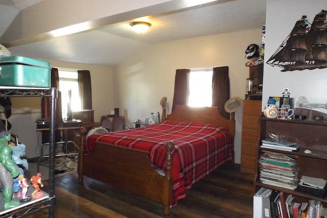bedroom with wood finished floors and vaulted ceiling